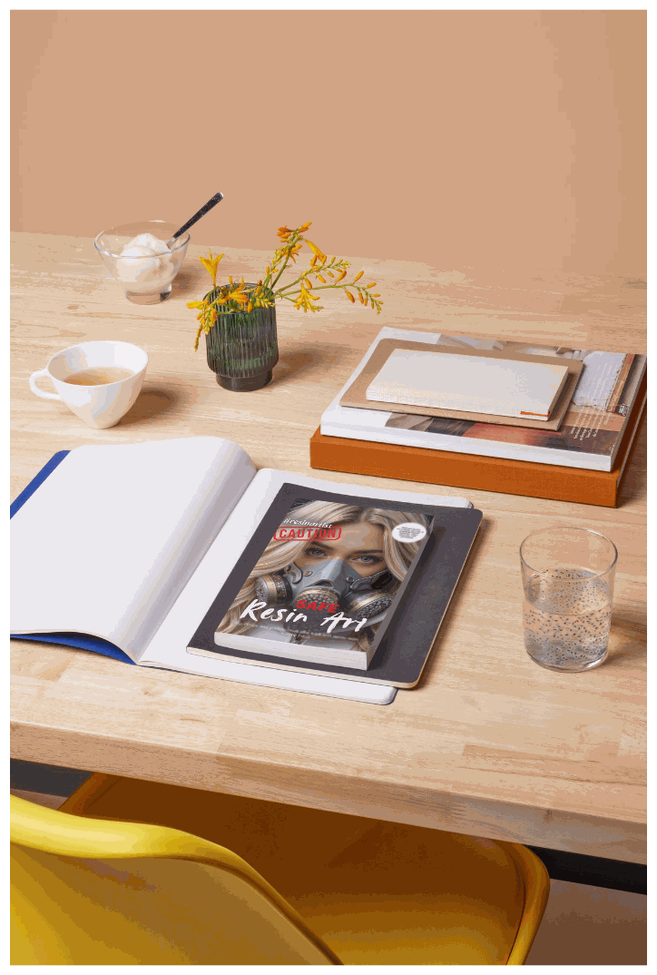 Safe Resin Art as a flat lay on a desk with tea and flowers